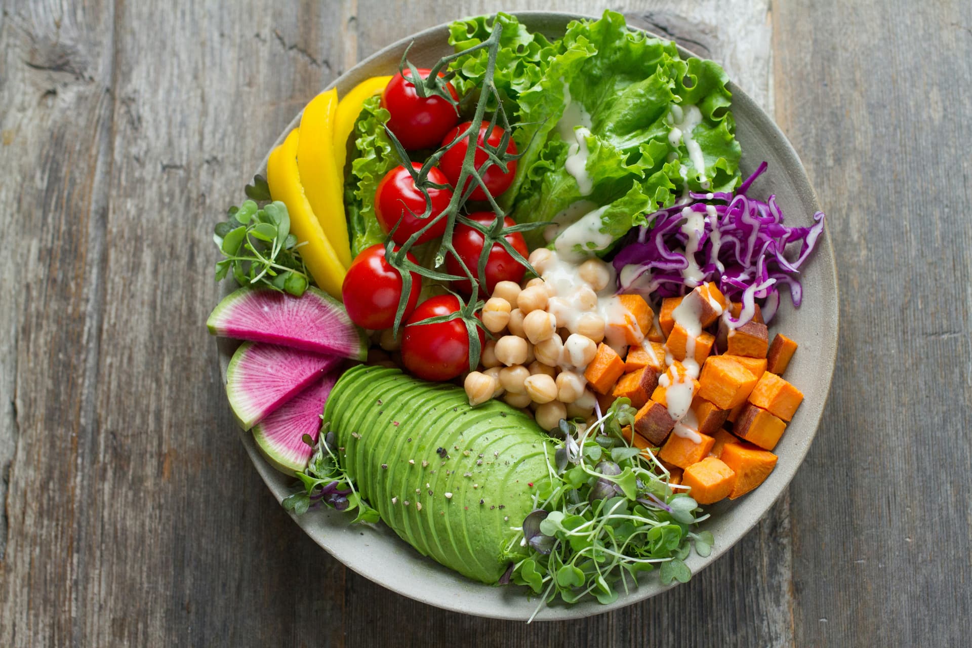 Fresh salad bowl with vegetables on a table